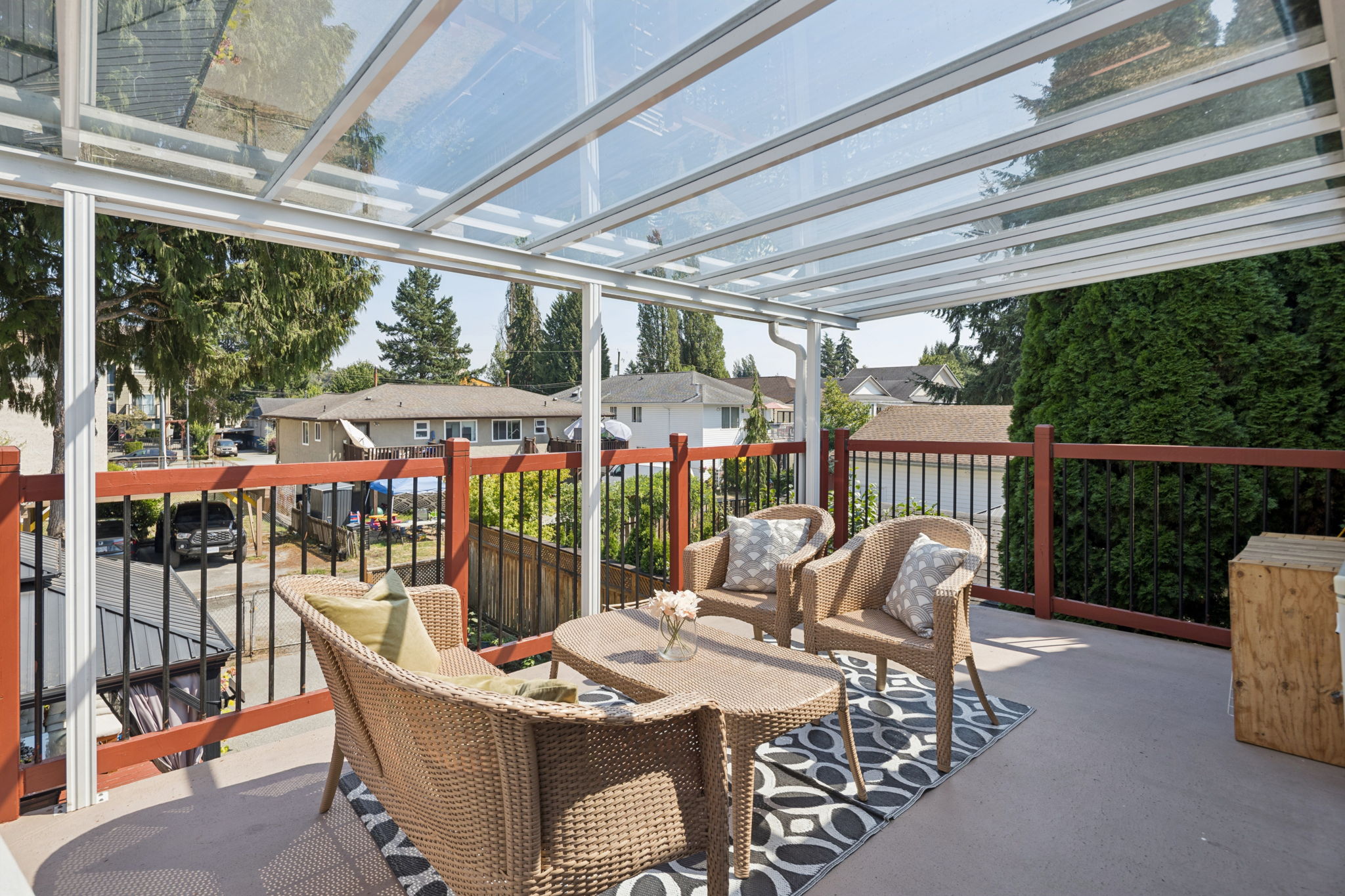 Covered upper deck with seating overlooking the neighbourhood