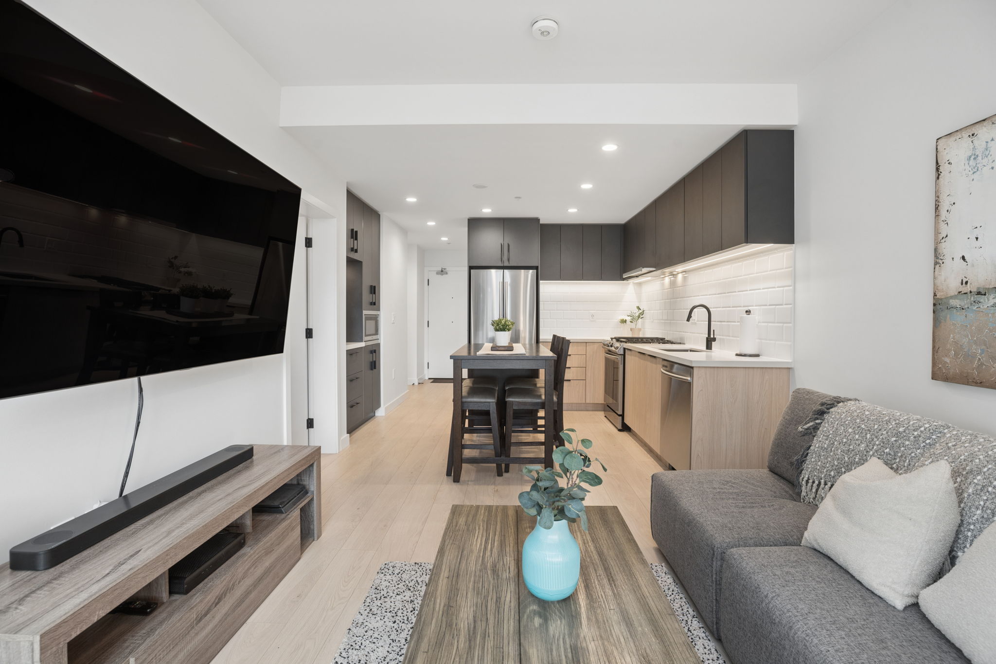Open-concept living, dining, and kitchen space